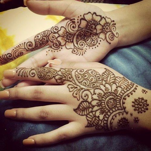 Hands decorated in henna.