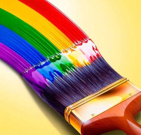 A paintbrush paints a rainbow.