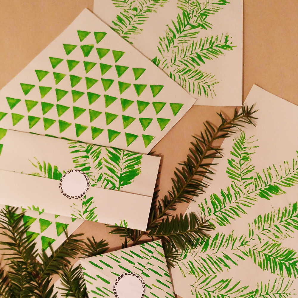 Wrapping paper with pine bough prints.