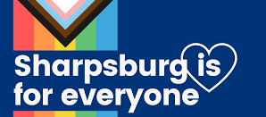 Vertical inclusive rainbow flag with text reading "Sharpsburg is for everyone." A heart outline is over the word "is."