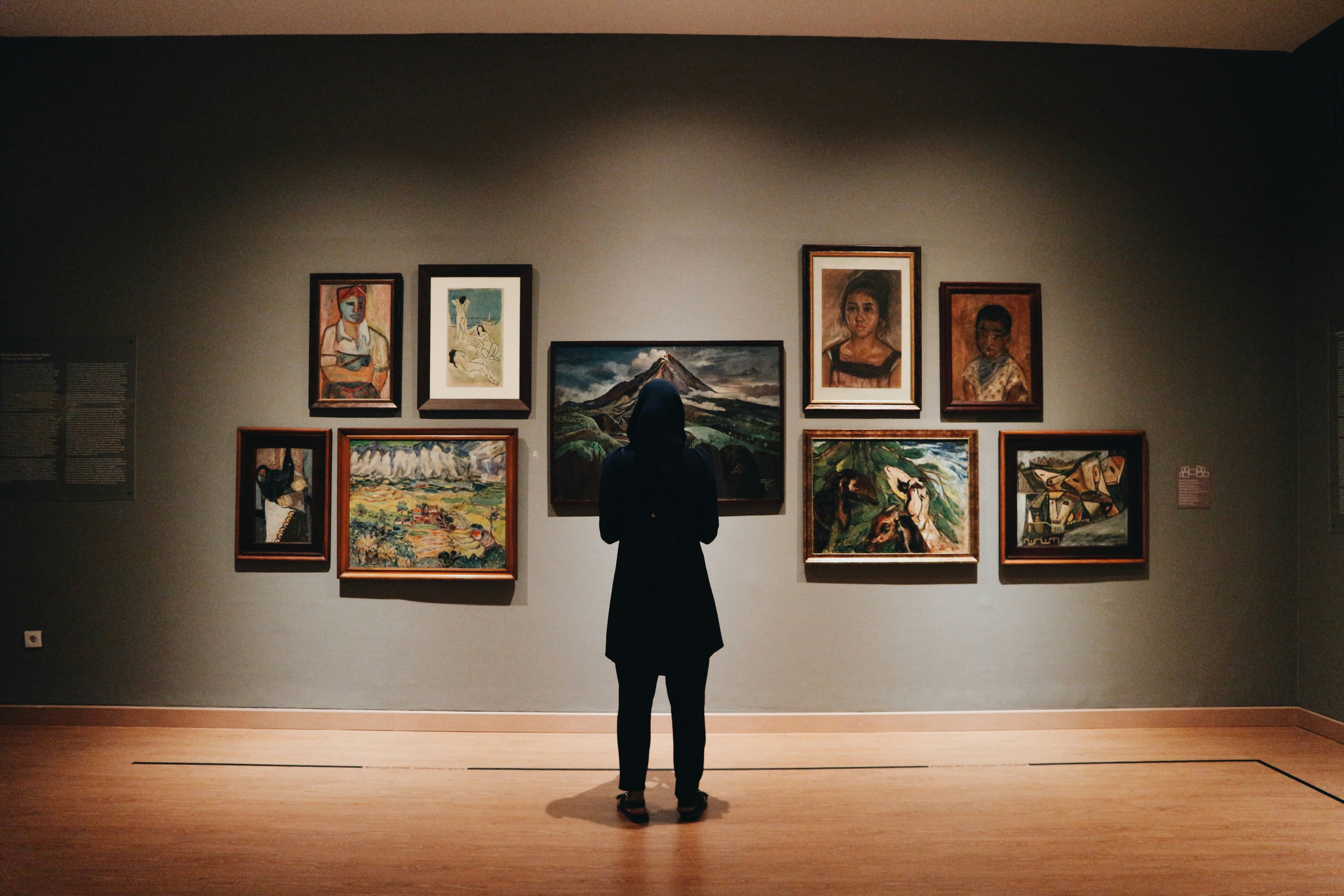 person looking at art in museum