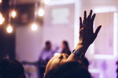 Raised hand at a lecture