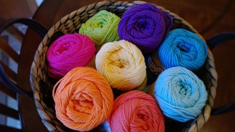 A basket of multi-colored yarn.