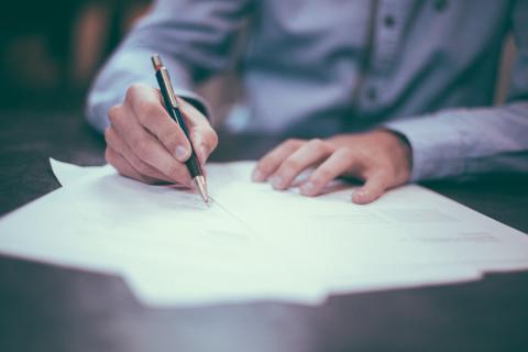 Man filling out paperwork