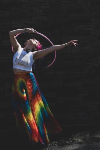 A person practices hoop yoga.