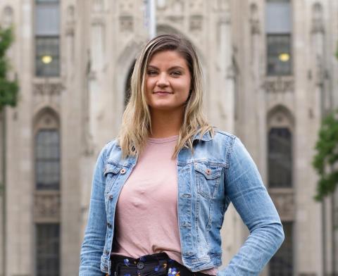 Photo of Kelly, a white woman with shoulder length blonde hair wearing a jean jacket with pink shirt.