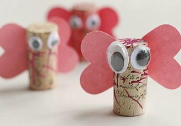 Wine corks turned into bugs with craft materials.