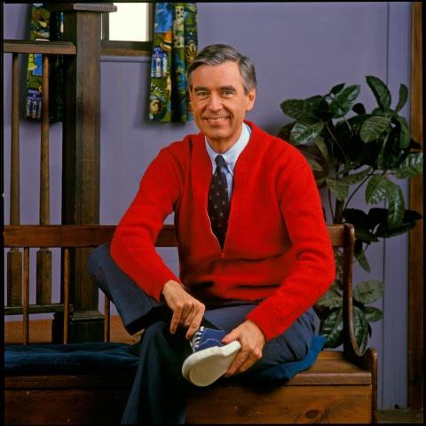 Photo of Mr. Rogers wearing a red cardigan