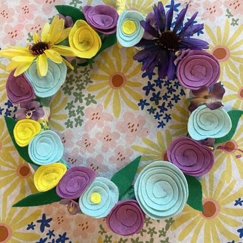 a photo of a handmade wreath with felt flowers and silk flowers