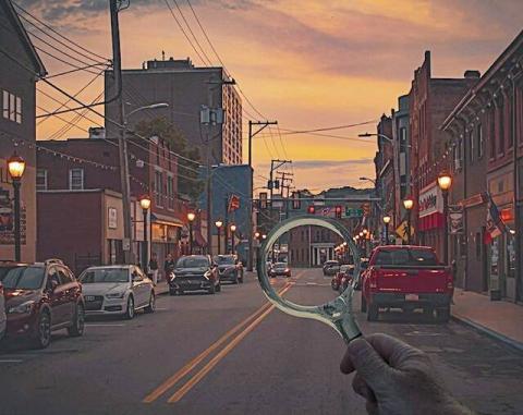 Photo of Main Street Sharpsburg with a magnifying glass being held over the street