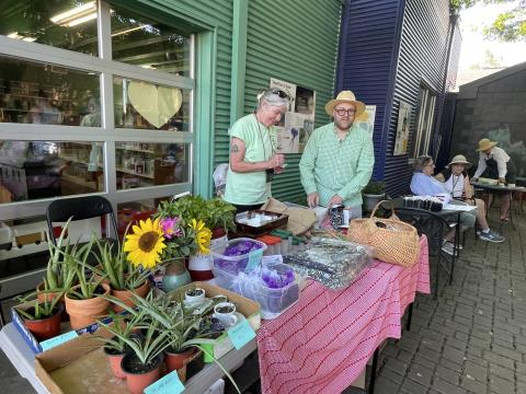 Photo of Sharpsburg Community Garden members in courtyard during Garden Party