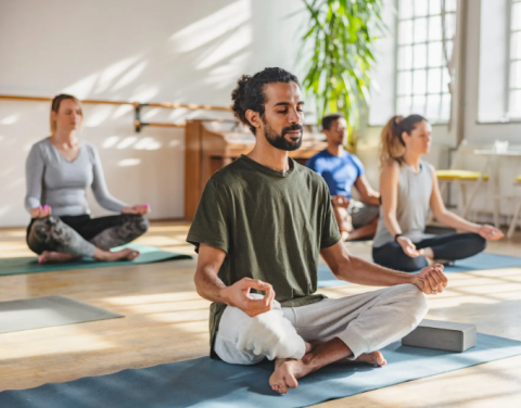 A photo of a group of people meditating