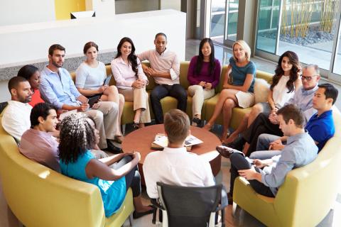 Photo of focus group - multicultural group of participants seated in semicircle