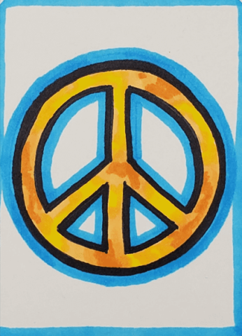 A yellow peace symbol is drawn with markers and has a light blue halo outline.