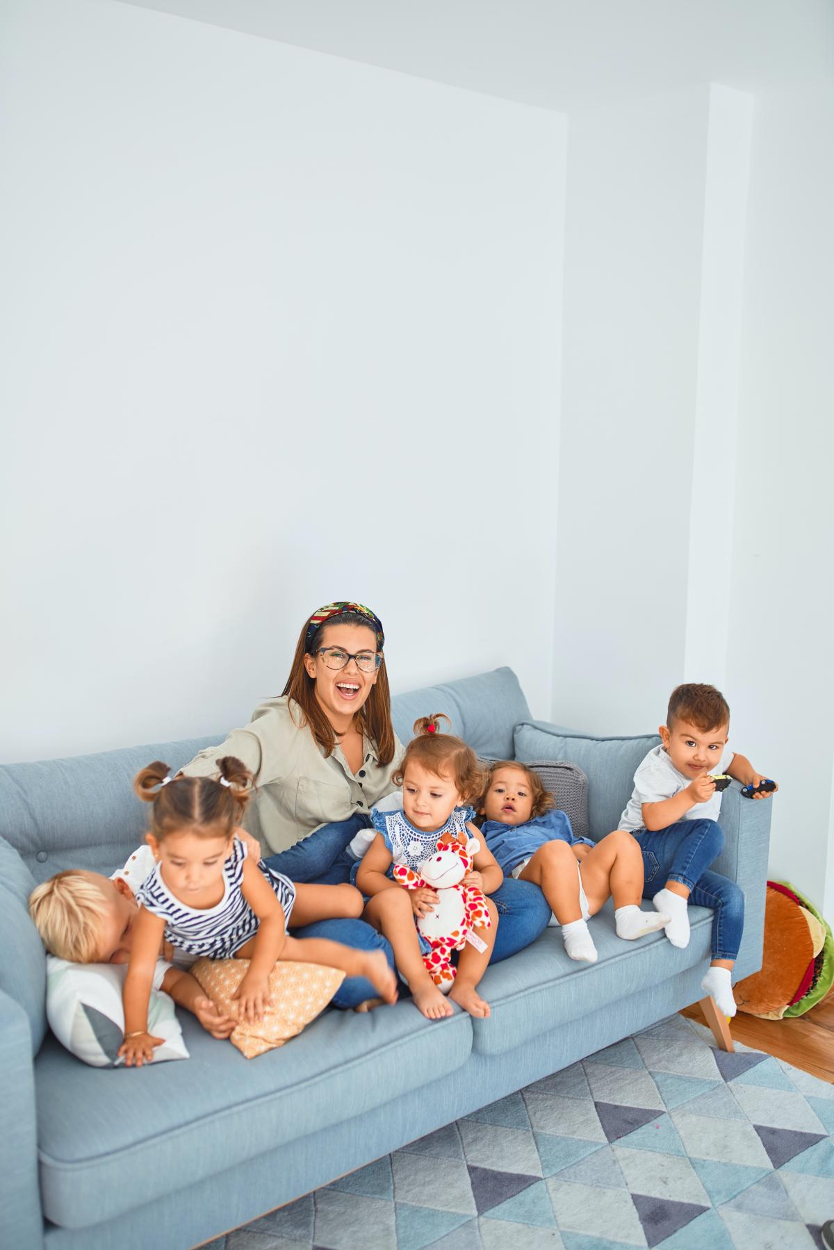 family sits on the couch together