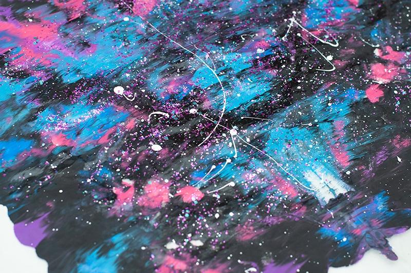 A galaxy painting with black, pink, purple, and blue.