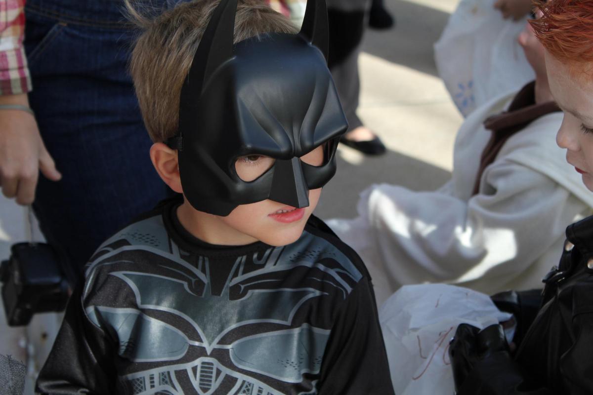 Child in Batman Halloween costume.