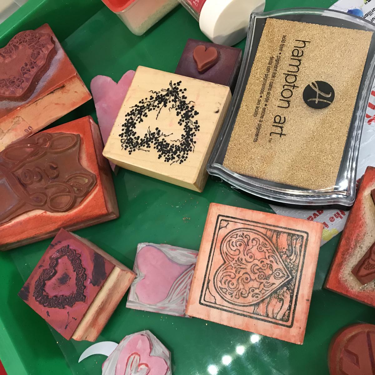 A photo of valentines and printmaking stamps