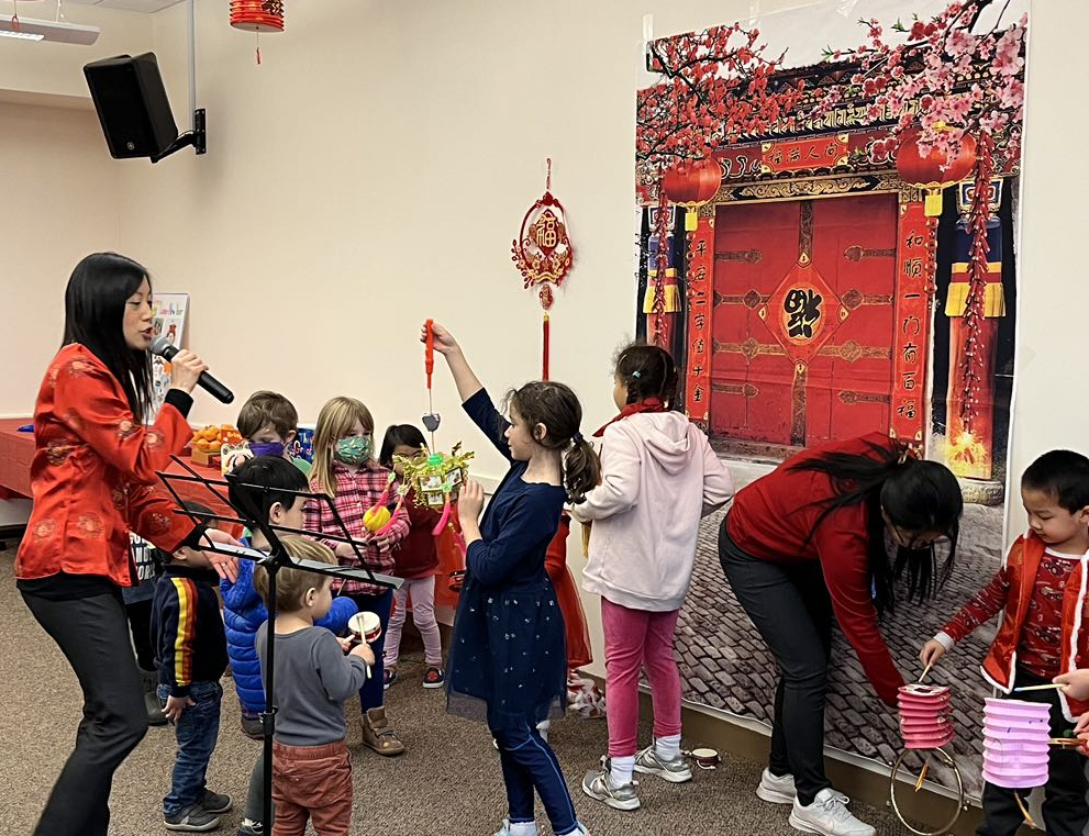 Kids getting ready for a dragon parade.