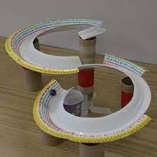 Roller coaster marble run made with paper plates and cardboard tubes