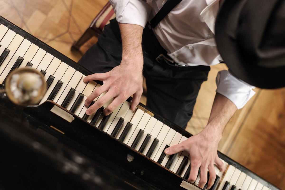 Photo of hands on a piano