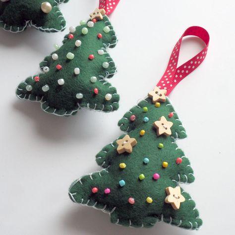 2 green felt Christmas tree ornaments are shown