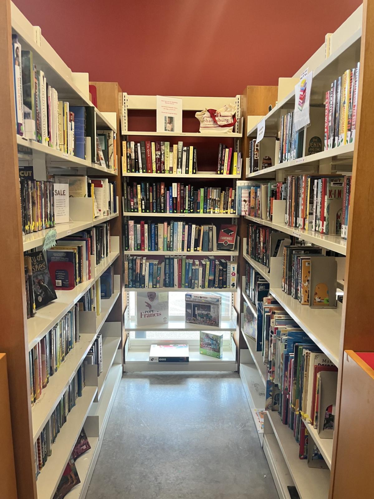 Photo of Sharpsburg Community Library Book Sale Nook fully stocked with books on 3 sides