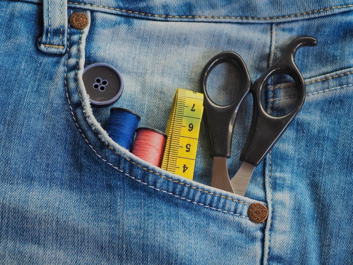 A photo of craft supplies in a jean pocket.