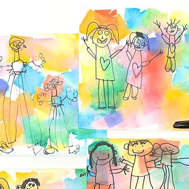 CHildren's drawing of people cover a vibrantly painted piece of paper.
