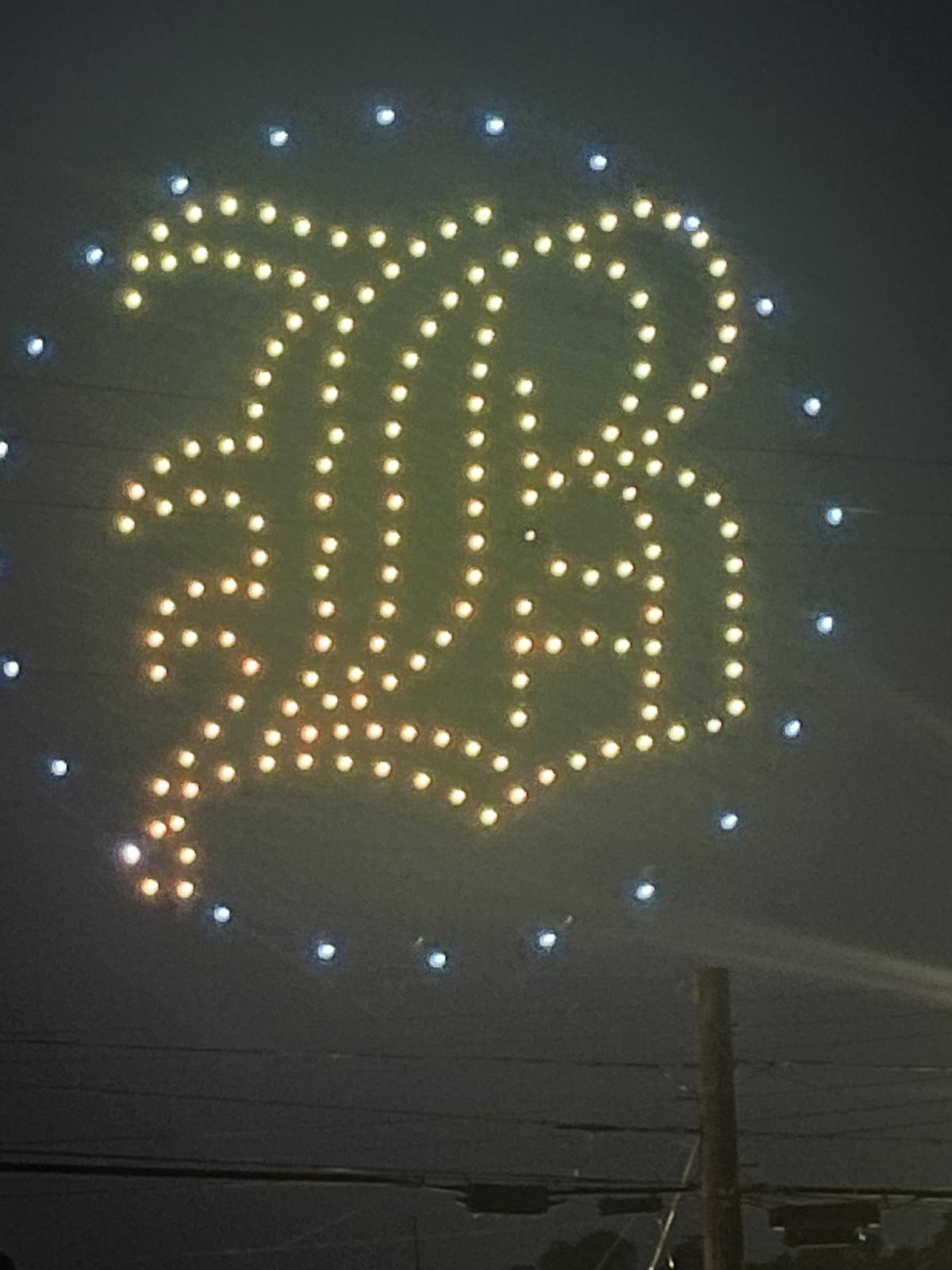 Lights create a stylized Old English script B for Blawnox in blue and gold